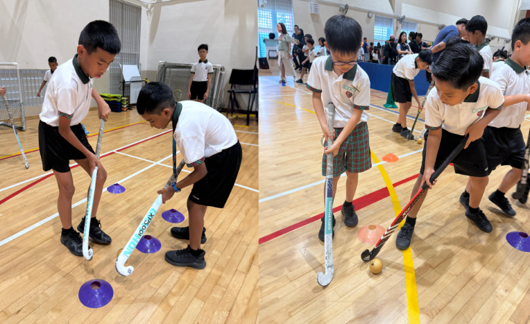 The P5 Hockey Boys guiding the P2 students during the CCA Bazaar.